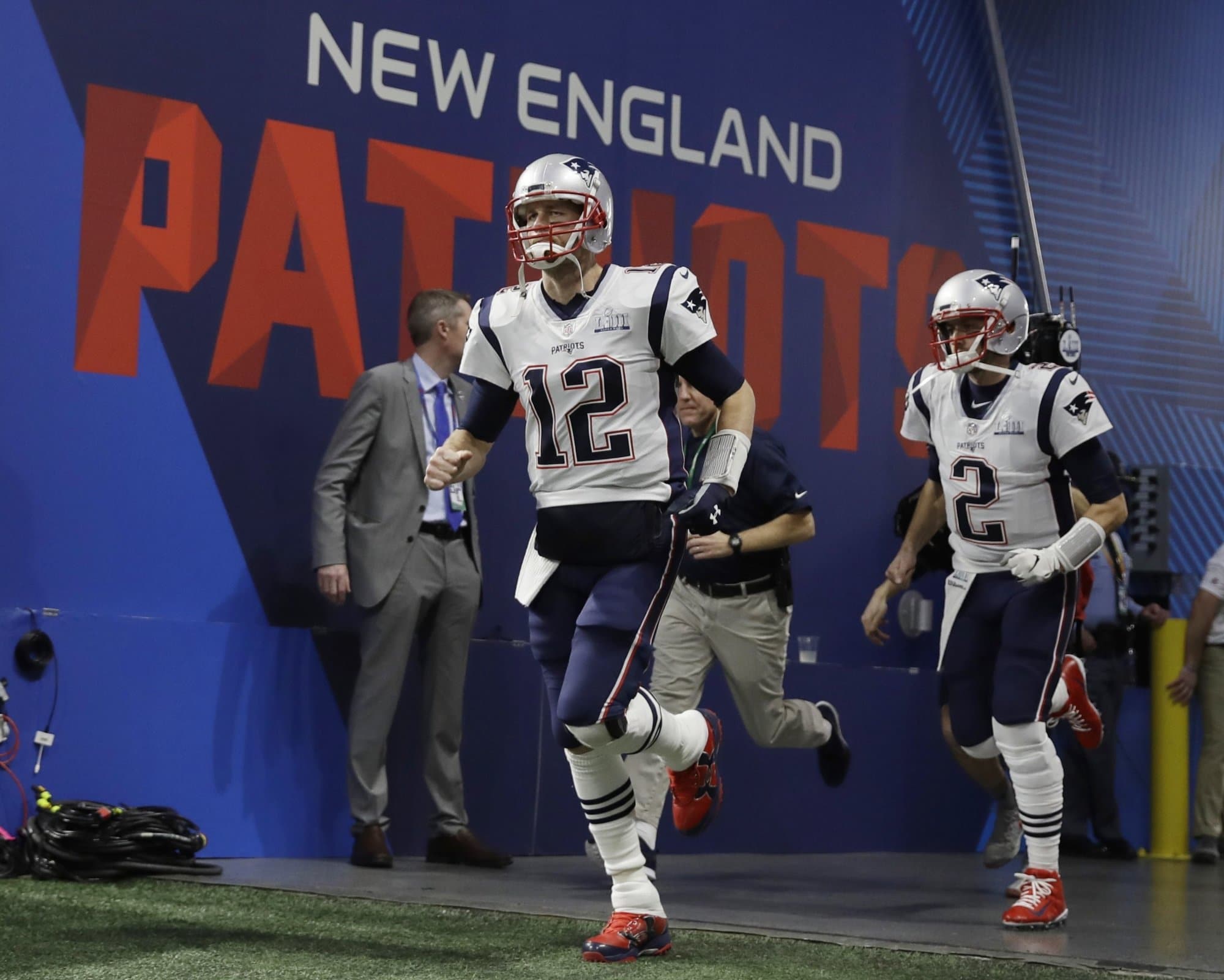 New England Patriots' Tom Brady (12) and Brian Hoyer (2) enter the field, before the NFL Super Bowl 53 football game between the Los Angeles Rams and the New England Patriots Sunday, Feb. 3, 2019, in Atlanta. (AP Photo/Matt Rourke)