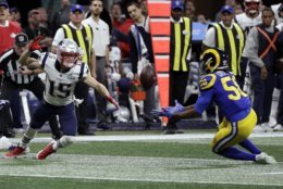 Los Angeles Rams' Cory Littleton, right, intercepts a pass intended for New England Patriots' Chris Hogan, left, during the first half of the NFL Super Bowl 53 football game Sunday, Feb. 3, 2019, in Atlanta. (AP Photo/David J. Phillip)