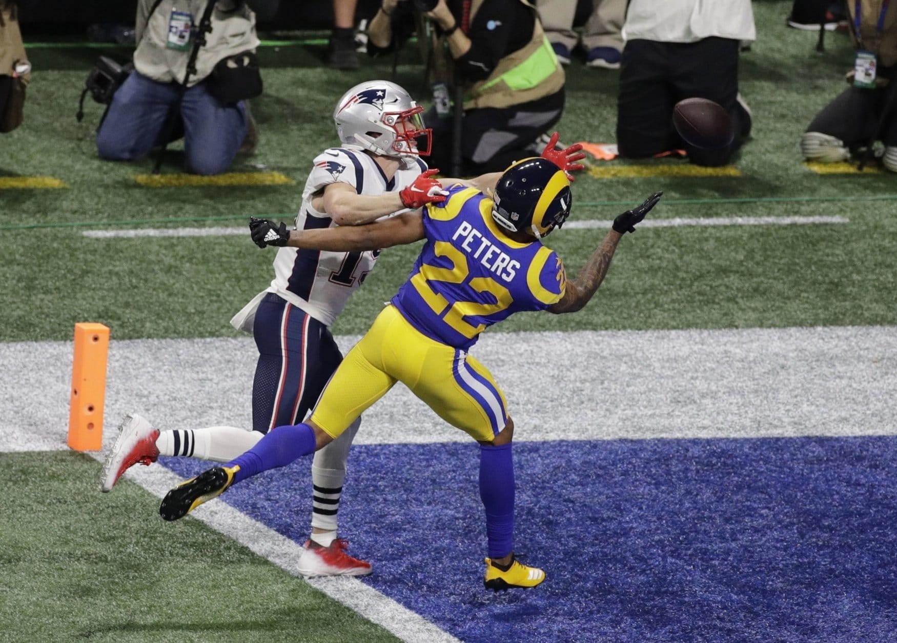 New England Patriots' Chris Hogan (15) is defended by Los Angeles Rams' Marcus Peters (22) during the first half of the NFL Super Bowl 53 football game Sunday, Feb. 3, 2019, in Atlanta. (AP Photo/Charlie Riedel)
