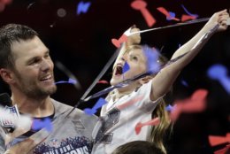 New England Patriots' Tom Brady holds his daughter, Vivian, after the NFL Super Bowl 53 football game against the Los Angeles Rams, Sunday, Feb. 3, 2019, in Atlanta. The Patriots won 13-3. (AP Photo/Lynne Sladky)