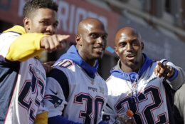 New England Patriots (l-r) Eric Rowe, Jason McCourty and Devin McCourty react to fans during their victory parade through downtown Boston, Tuesday, Feb. 5, 2019, to celebrate their win over the Los Angeles Rams in Sunday's NFL Super Bowl 53 football game in Atlanta. The Patriots have won six Super Bowl championships. (AP Photo/Elise Amendola)