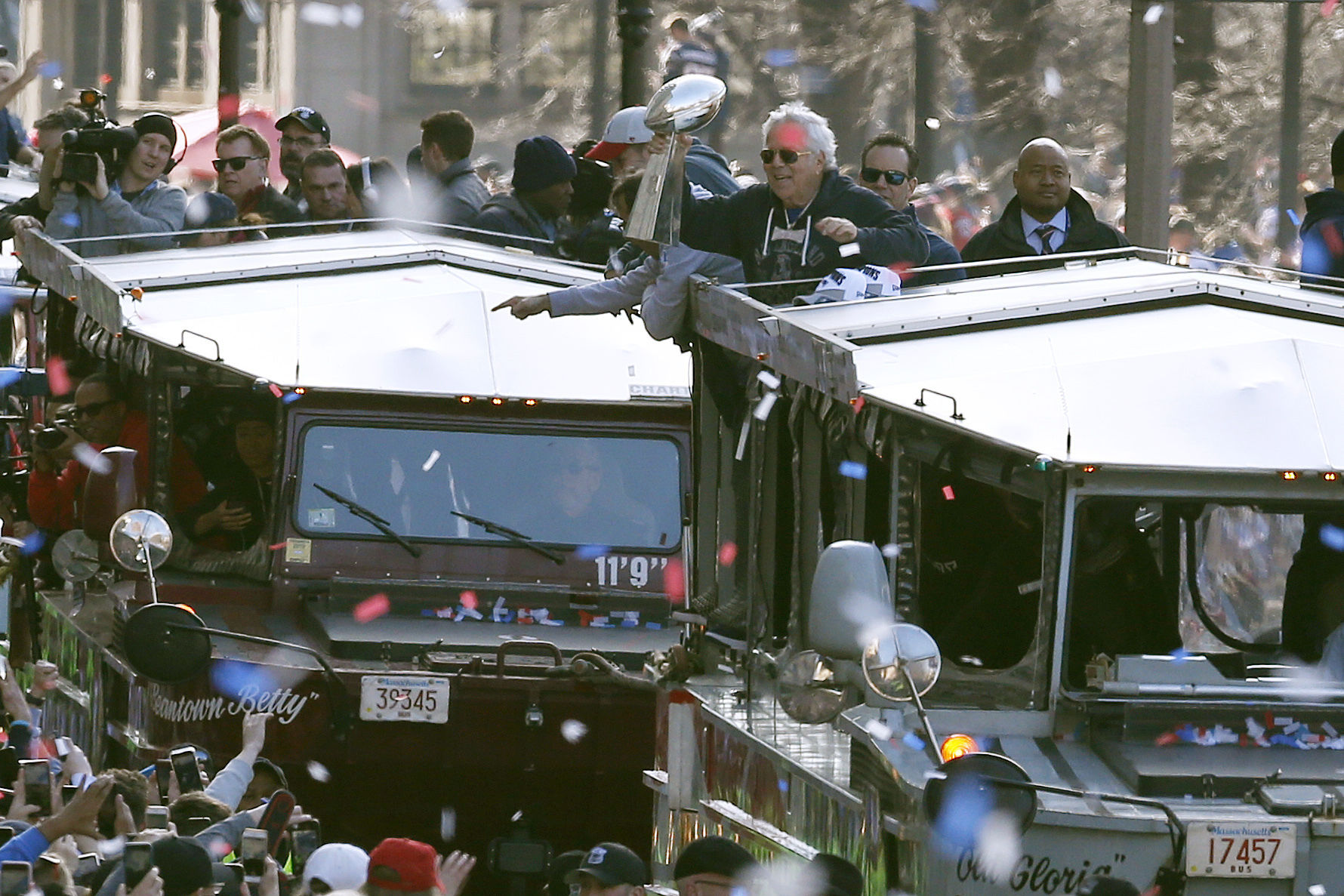 New England Patriots owner Robert Kraft holds the trophy as the team parades through downtown Boston, Tuesday, Feb. 5, 2019, to celebrate their win over the Los Angeles Rams in Sunday's NFL Super Bowl 53 football game in Atlanta. (AP Photo/Michael Dwyer)