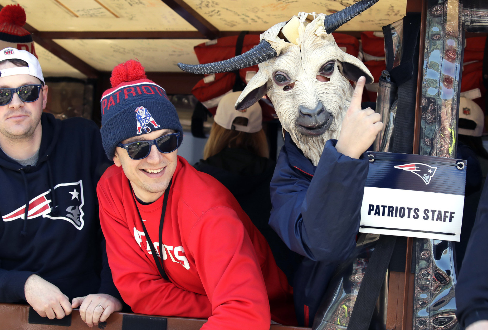 A member of the New England Patriots staff wears a goat mask during a victory parade through downtown Boston, Tuesday, Feb. 5, 2019, to celebrate their win over the Los Angeles Rams in Sunday's NFL Super Bowl 53 football game in Atlanta. The Patriots have won six Super Bowl championships. (AP Photo/Elise Amendola)