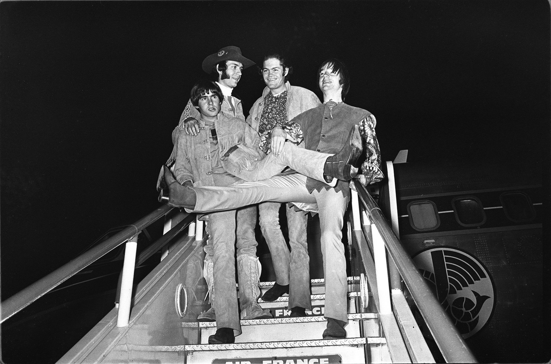 American pop group, the Monkees, pictured on arrival at London Airport, 28th June, 1967. Arriving from Paris, the group will perform a live stage show at the Empire Pool, Wembley, this coming weekend. Left to right are Davy Jones, Peter Tork, Micky Dolenz and Mike Nezsmith. (AP photo).