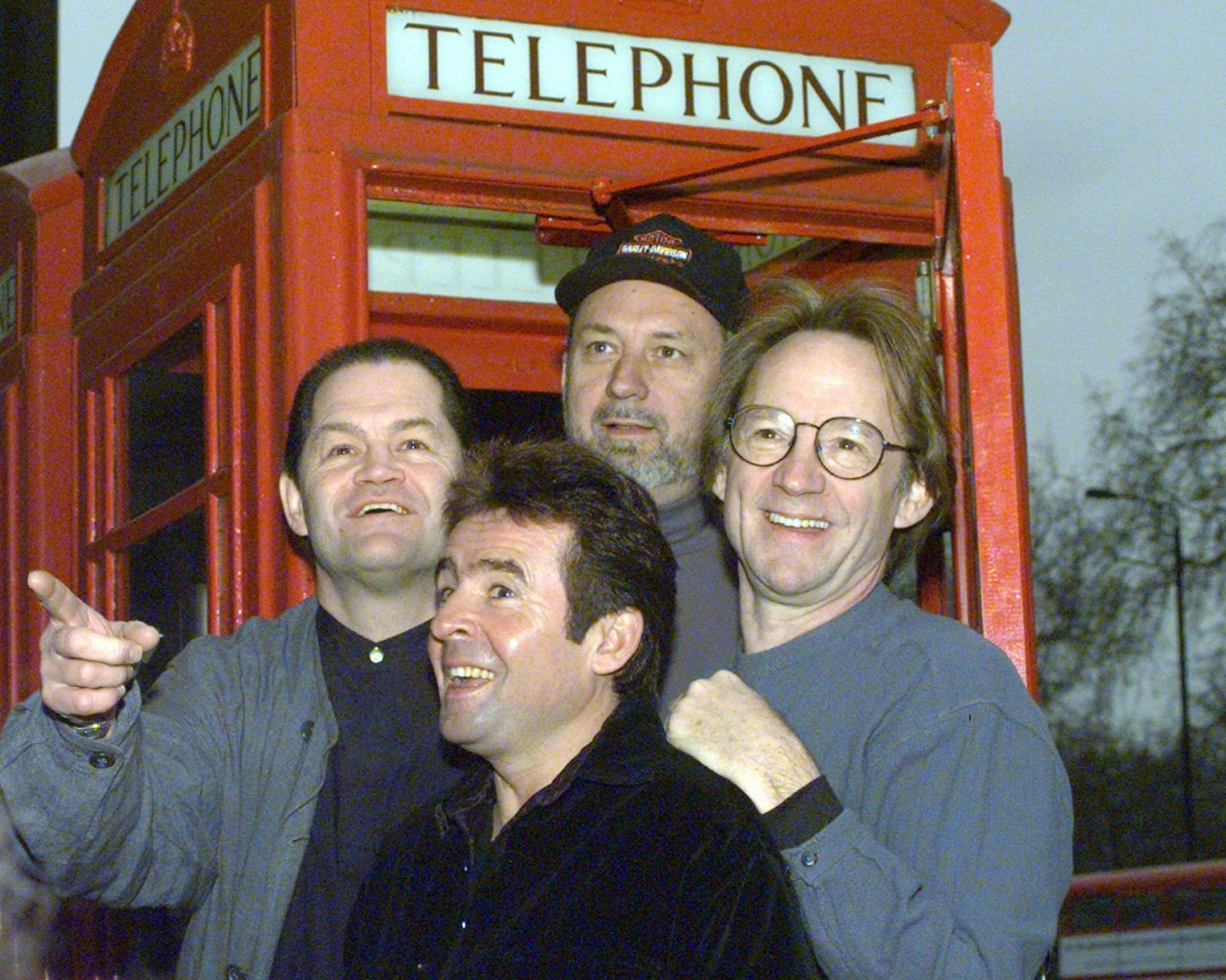 Members of the pop group The Monkees pose in front of a telephone booth in London  Friday, January 10, 1997 following a press conference at the Hard Rock Cafe where they announced plans for all four members of the group  to begin touring for the first time in 30 years.  From left to right are Mickey Dolenz, Davy Jones, Mike Nesmith and Peter Tork.  (AP Photo/Lynne Sladky)