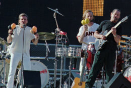 Davey Jones, left, Peter Tork, center, and Micky Dolenz, right,  three of the original members of the group known as "The Monkees" perform for the crowd before the Giants-Dodgers game at 3COM Park, Friday June 20, 1997, in San Francisco. (AP Photo/ Lacy Atkins)