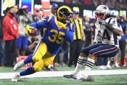 ATLANTA, GA - FEBRUARY 03: C.J. Anderson #35 of the Los Angeles Rams runs the ball against Dont'a Hightower #54 of the New England Patriots in the second half during Super Bowl LIII at Mercedes-Benz Stadium on February 3, 2019 in Atlanta, Georgia.  (Photo by Harry How/Getty Images)