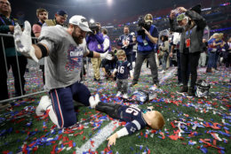 ATLANTA, GA - FEBRUARY 03:  James Develin #46 of the New England Patriots celebrates with his son after the Super Bowl LIII against the Los Angeles Rams at Mercedes-Benz Stadium on February 3, 2019 in Atlanta, Georgia. The New England Patriots defeat the Los Angeles Rams 13-3.  (Photo by Jamie Squire/Getty Images)