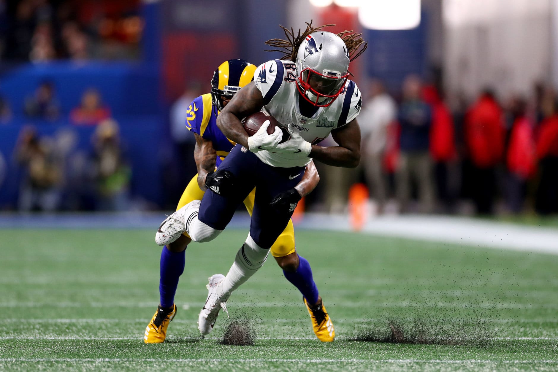 ATLANTA, GEORGIA - FEBRUARY 03:  Cordarrelle Patterson #84 of the New England Patriots is tackled by Marcus Peters #22 of the Los Angeles Rams in the second quarter during Super Bowl LIII at Mercedes-Benz Stadium on February 03, 2019 in Atlanta, Georgia. (Photo by Maddie Meyer/Getty Images)
