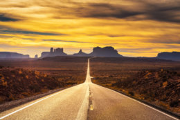Desert road leading to Monument Valley photographed at the Forrest Gump Point with dramatic sunset sky. (Getty Images/iStockphoto)