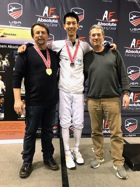 DCFC Head Coach Janusz Smolenski, Justin Haddad, and proud father Robert Haddad celebrate Justin's National Championship title. (Courtesy D.C. Fencer's Club)