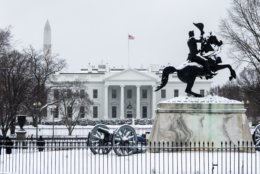 A snow-capped White House and frozen Lafayette Square. (WTOP/Alejandro Alvarez)