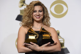 Tori Kelly poses in the press room with the awards for best gospel performance/song for "Never Alone" and best gospel album for "Hiding Place" at the 61st annual Grammy Awards at the Staples Center on Sunday, Feb. 10, 2019, in Los Angeles. (Photo by Chris Pizzello/Invision/AP)