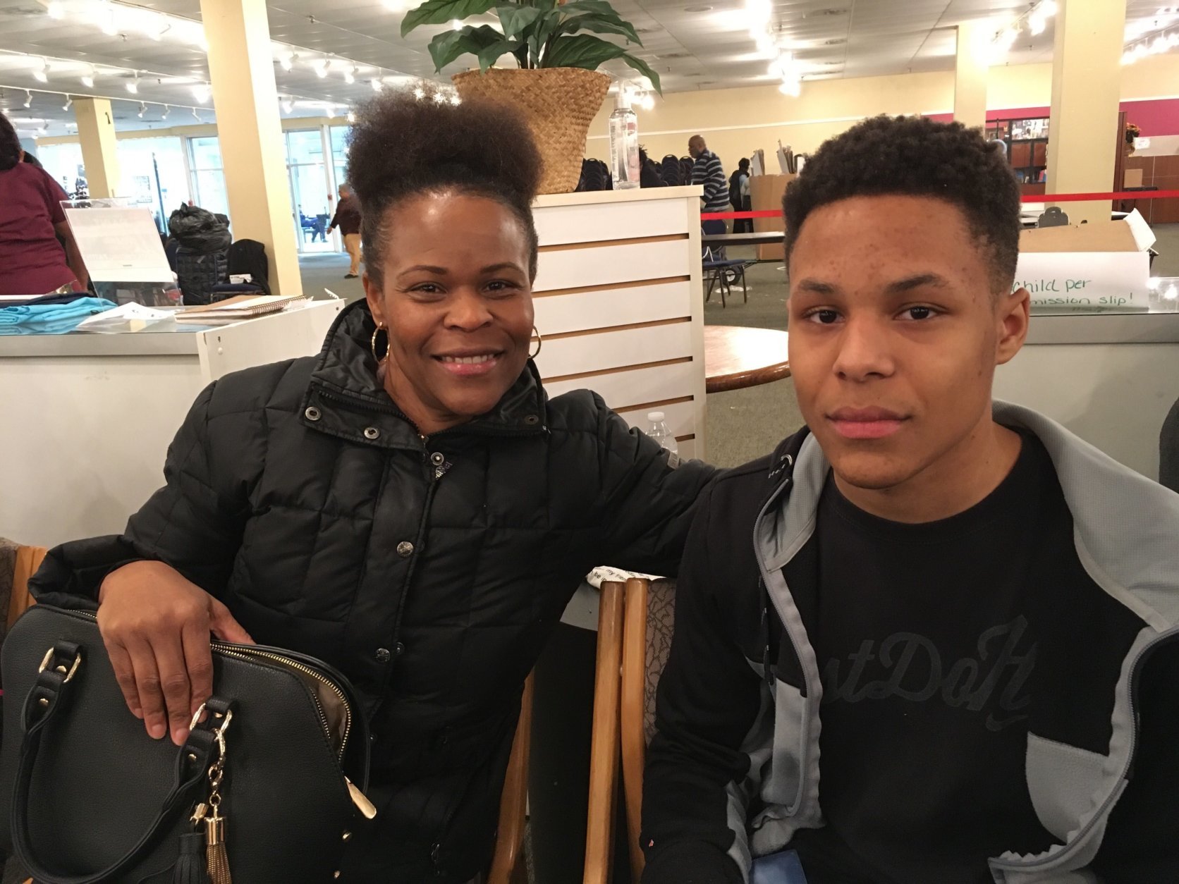 Joshua Lewis (left) of Upper Marlboro heard about this event through his mom (right). He hopes to make money and gain more work experience from a summer job. (WTOP/Liz Anderson) 