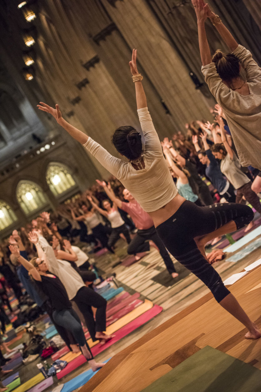 Yogis strike a pose Wednesday night at the Washington National Cathedral. About 1,200 showed up for the sold-out yoga-and-meditation night, which is part of the week's "Seeing Deeper" events. (Courtesy Washington National Cathedral/Danielle E.Thomas)