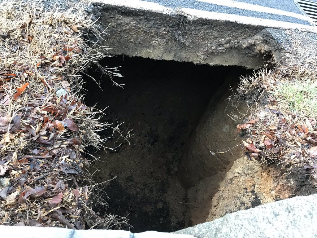 The National Park Service said the sinkhole appeared to be caused by a broken stormwater pipe below ground. The 10-feet-deep sinkhole caused the Park Service to close the parkway in both directions earlier Friday morning. (Courtesy National Park Service)