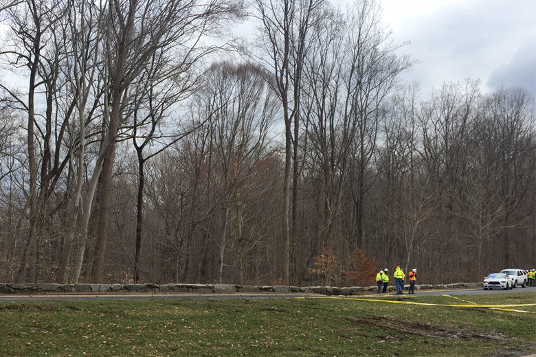 Crews assess the sinkhole in the northbound lanes of the George Washington Parkway Friday March 22, 2019. (WTOP/John Domen)