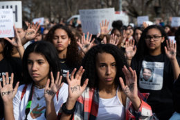 Many students at the walkout wrote "don't shoot" on their hands, the final words of Michael Brown before his death at the hands of a police officer in Ferguson, Missouri on Aug. 4, 2014. Those words have since become a rallying cry for activism against gun violence and police brutality. (WTOP/Alejandro Alvarez)