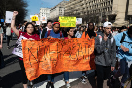 A banner signed by actiivsts is carried down Pennsylvania Avenue during a 2-mile gun control march to the Capitol led by Montgomery County-based student group, MoCo Students for Change. (WTOP/Alejandro Alvarez)