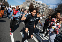 Students dance in the middle of Pennsylvania Avenue during a march to the Capitol building. (WTOP/Alejandro Alvarez)