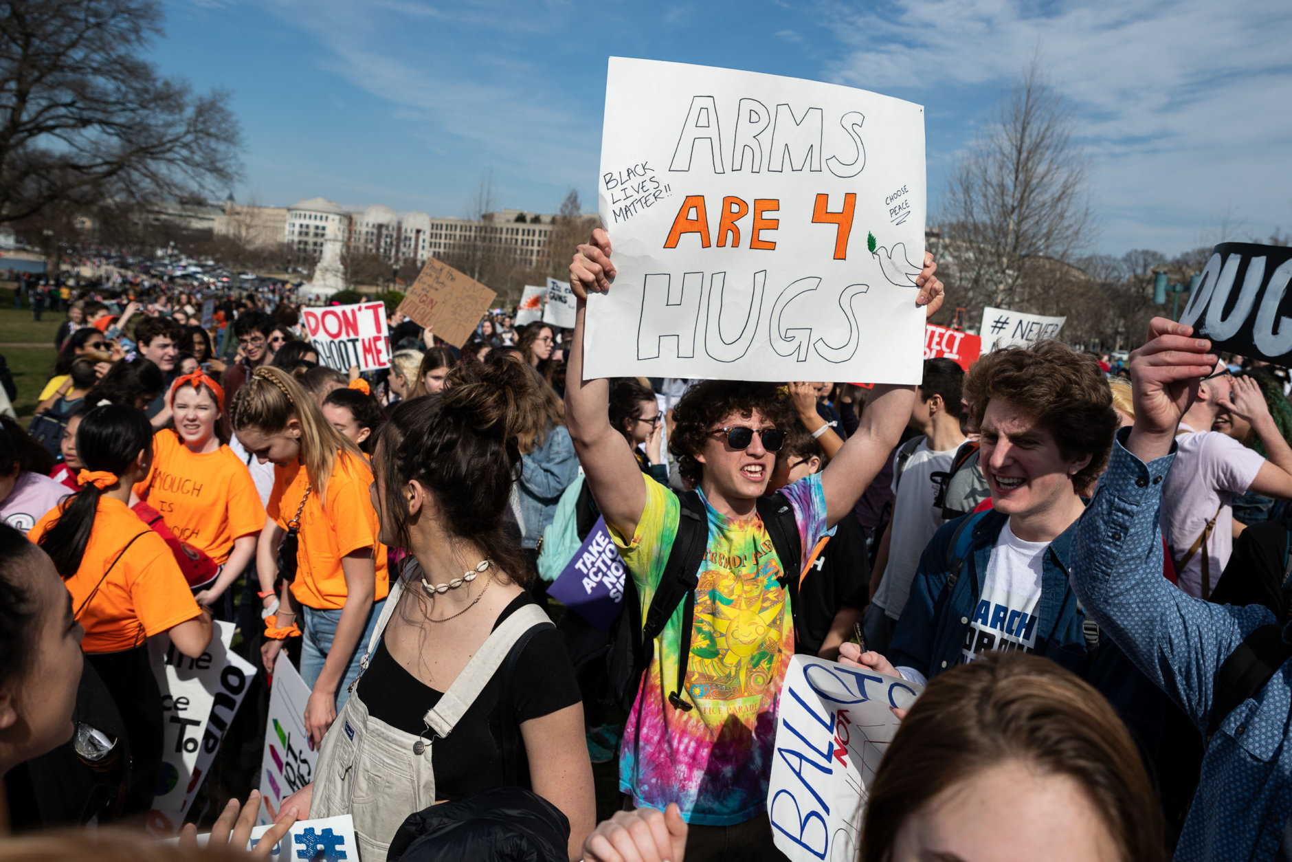 Hundreds of students stream into the Capitol building's west lawn on Thursday afternoon, following a long but fast march from the White House through the heart of downtown D.C. (WTOP/Alejandro Alvarez)
