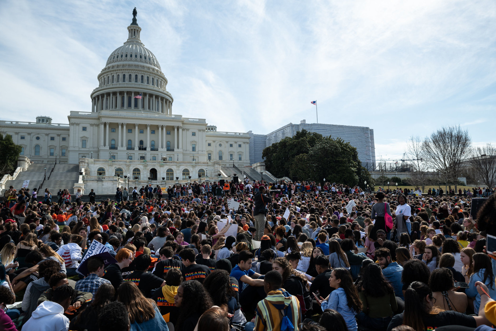 Once at the Capitol, students sat and listened intently as members of Congress and fellow student activists took turns advocating for background check legislation and supporing the protest on the stage. (WTOP/Alejandro Alvarez)