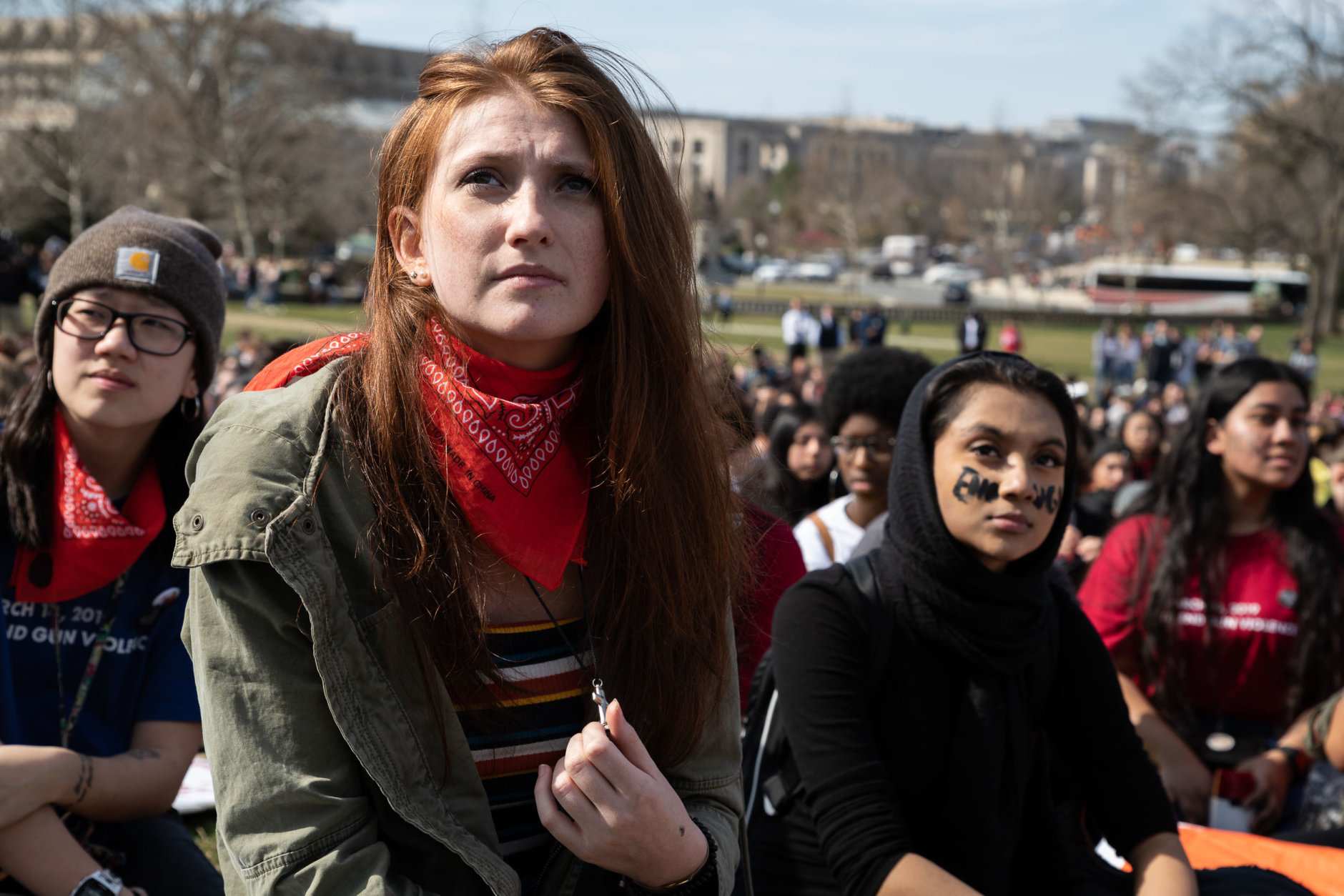 A student listens to members of Congress address the walkout outside the U.S. Capitol. (WTOP/Alejandro Alvarez