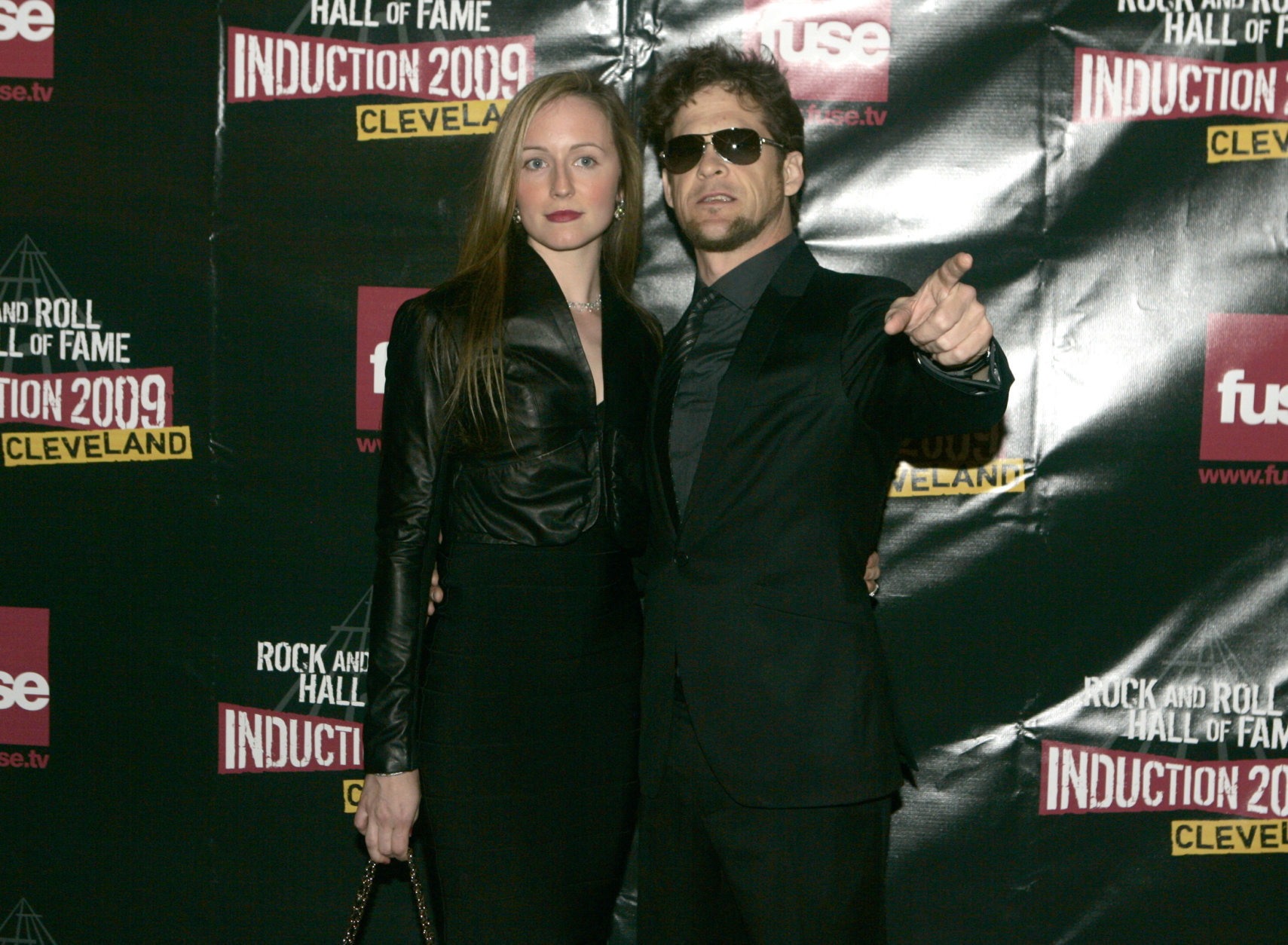 Nicole Smith and Jason Newsted of Metallica arrive on the red carpet for the 2009 Rock and Roll Hall of Fame Induction Ceremony Saturday, April 4, 2009 in Cleveland. (AP Photo/Tony Dejak)