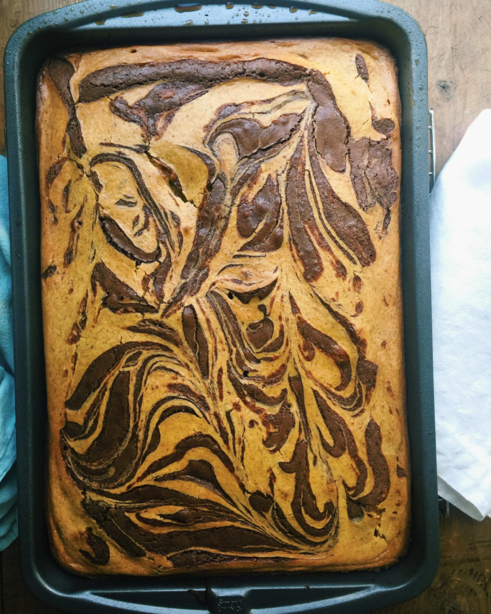 This September 2016 photo shows pumpkin cream cheese swirled chocolate brownies in New York. This dish is from a recipe by Katie Workman. (Katie Workman via AP)