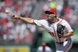 Washington Nationals starting pitcher Max Scherzer delivers a pitch during the first inning of a baseball game against the New York Mets, Thursday, March 28, 2019, in Washington. (AP Photo/Nick Wass)