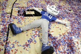 The Saint Louis mascot makes a confetti angel after Saint Louis defeated St. Bonaventure during an NCAA college basketball game in the Atlantic 10 men's tournament final Sunday, March 17, 2019, in New York. Saint Louis won 55-53. (AP Photo/Julio Cortez)