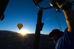 ALBUQUERQUE, NM - OCTOBER 6: Ken Walter of Waukesha, Wisconsin, pilots his balloon "Kay's Winddancer II" during the Mass Ascension on the first day of the 2018 Albuquerque International Balloon Fiesta on October 6, 2018 in Albuquerque, New Mexico. Walter has been flying balloons for thirty years and been coming to the Fiesta for twenty. The Albuquerque Balloon Fiesta is the largest hot air balloon festival, drawing more than 500 balloons from all over the world. 
(Photo by Maddie Meyer/Getty Images for Lumix)