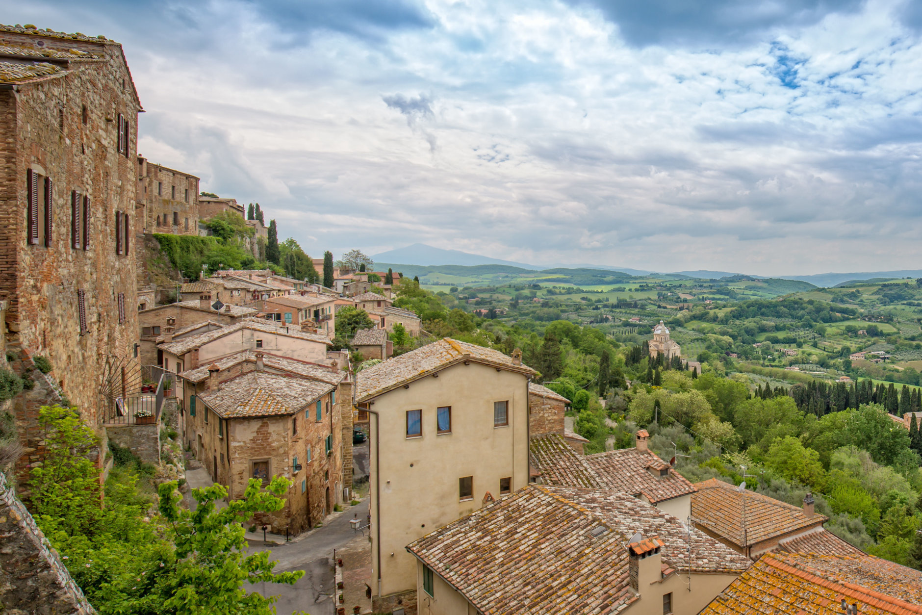 View from the city wall on the church of Madonna di San Biagio and the Tuscan countryside, Montepulciano, Italy