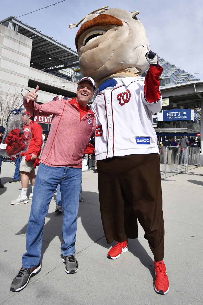WASHINGTON, DC - MARCH 28: A fan takes a photo with the Washington Nationals Racing Presidents before the game between the New York Mets and Washington Nationals on Opening Day at Nationals Park on March 28, 2019 in Washington, DC. (Photo by Patrick McDermott/Getty Images)