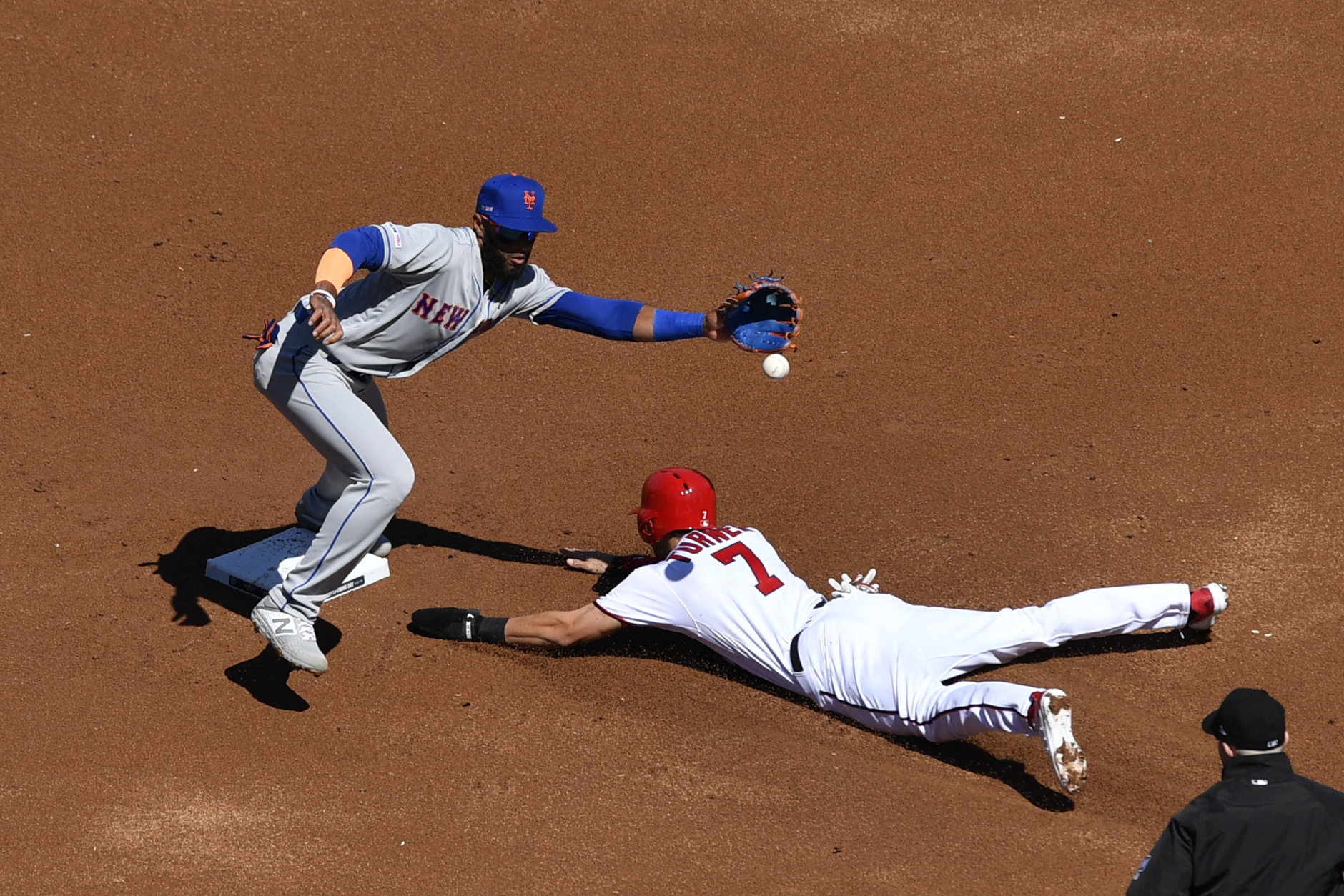 WASHINGTON, DC - MARCH 28: Trea Turner #7 of the Washington Nationals steals second base against Amed Rosario #1 of the New York Mets in the first inning on Opening Day at Nationals Park on March 28, 2019 in Washington, DC. (Photo by Patrick McDermott/Getty Images)
