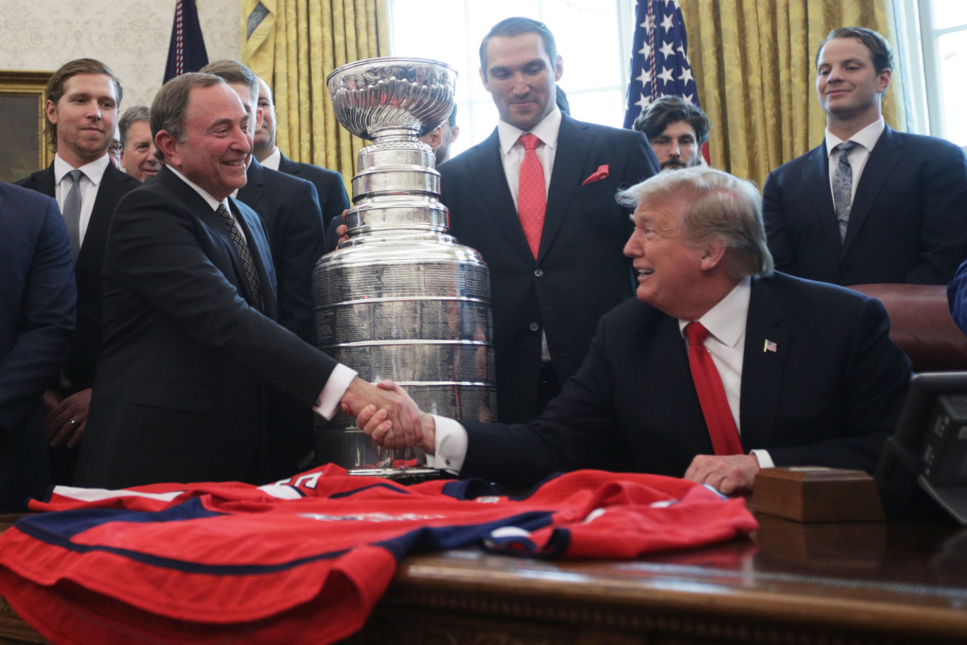 WASHINGTON, DC - MARCH 25:  U.S. President Donald Trump shakes hands with National Hockey League commissioner Gary Bettman during an Oval Office event at the White House March 25, 2019 in Washington, DC. President Trump hosted the Washington Capitals to honor their 2018 Stanley Cup championship. (Photo by Alex Wong/Getty Images)