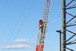 A worker in D.C. descended a ladder after suffering hypothermia on a radio tower. (Courtesy DC Fire and EMS/Twitter)