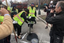 “We know that this is frustrating, and that’s why our crews have been out working tirelessly since January filling as many potholes as possible,” Bowser said. (WTOP/Max Smith)