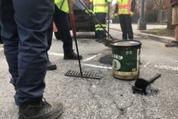 DDOT crews get starting on tackling the many potholes that plague D.C. at the start of "Potholepalooza." (WTOP/Max Smith)