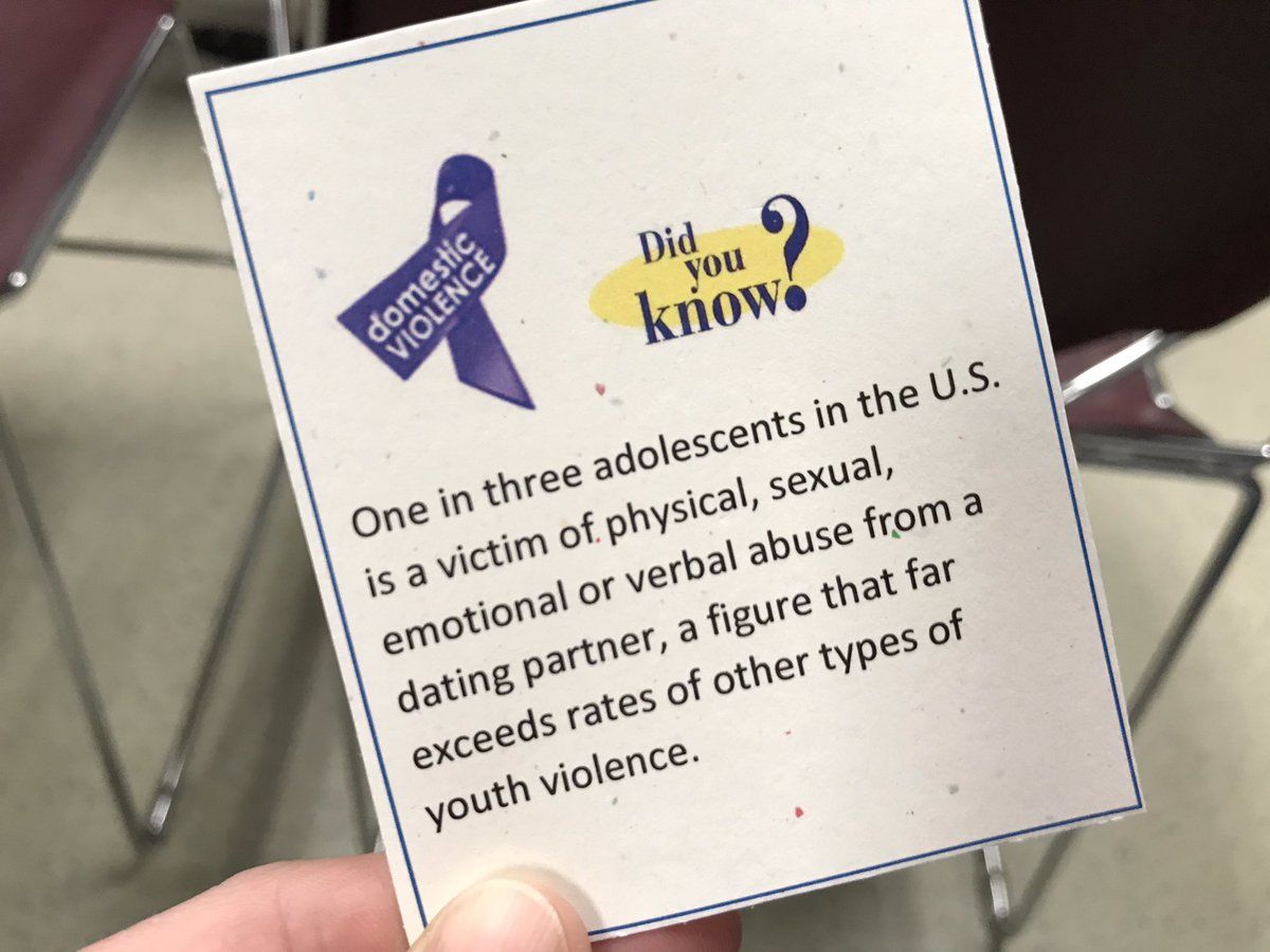 Attendees of the ceremony also received slips of paper with often surprising facts about domestic violence written on them. As part of the program, people volunteered to stand and read the fact they had been given. (WTOP Michelle Basch)