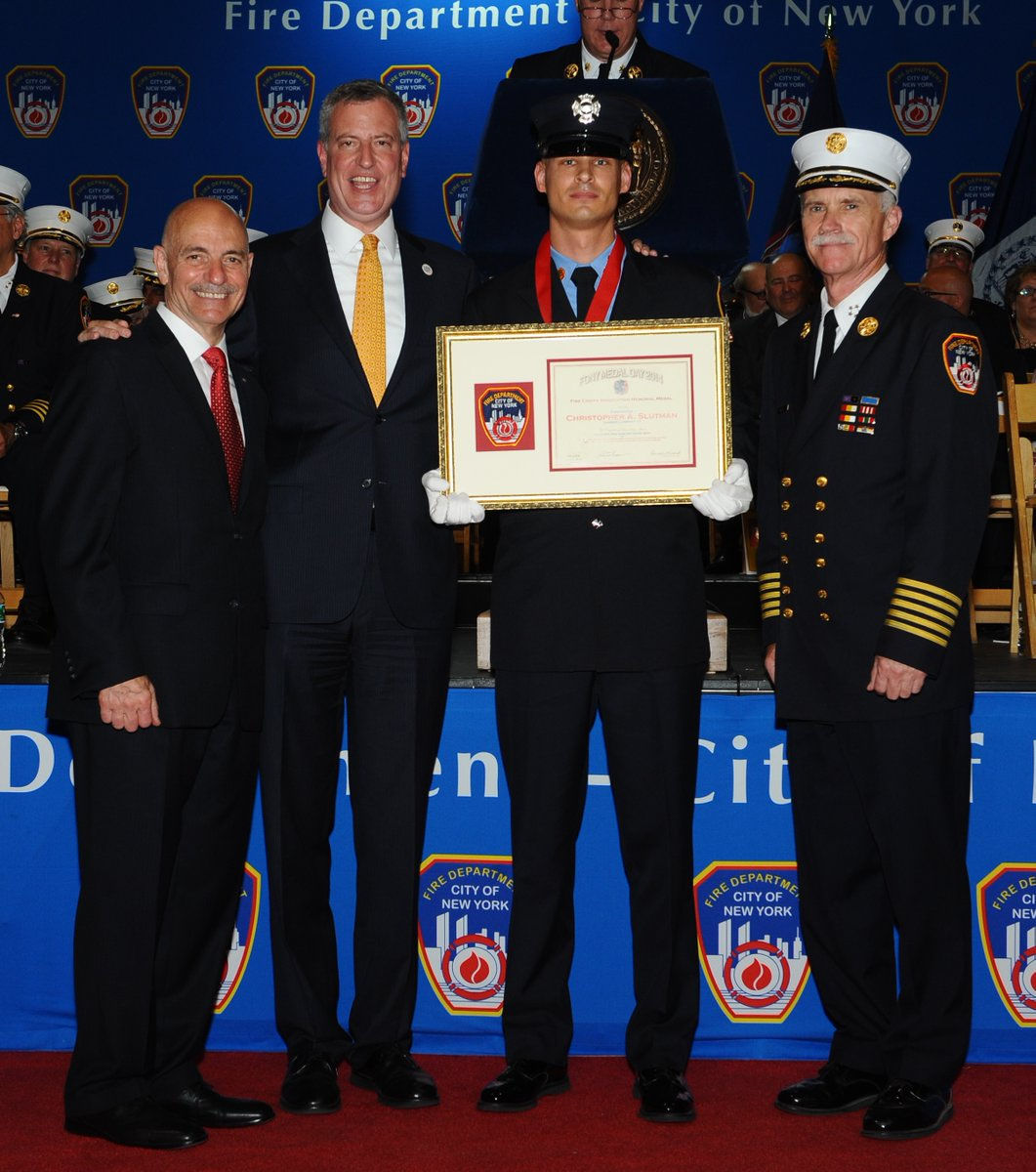 In 2014, New York mayor Bill de Blasio awarded Slutman with the Fire Chief's Association Memorial Medal after he rescued an unconscious woman from a burning apartment in the South Bronx. (Courtesy New York City Fire Department)