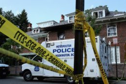 WASHINGTON, DC - MAY 19:  District of Columbia Metropolitan Police maintain a perimeter around the house on the 3200 block of Woodland Drive NW May 19, 2015 in Washington, DC. Firefighters discovered the bodies of Savvas Savopoulos, 46, his wife Amy, 47, their 10-year-old son Philip, and the housekeeper, Veralicia Figueroa, 57, last Thursday afternoon when they responded to a blaze at the house. Two Savopoulos daughters were away in boarding school at the time. Investigators have ruled the deaths homicides and say they could continue to collect evidence at the house for another week.  (Photo by Chip Somodevilla/Getty Images)