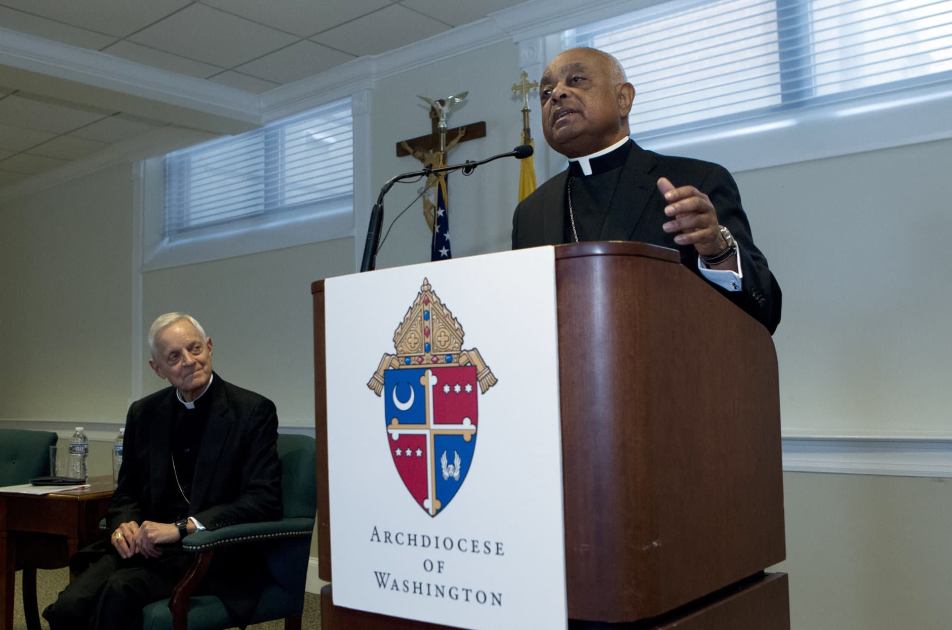 Archbishop designated by Pope Francis to the Archdiocese of Washington, Archbishop Wilton D. Gregory, speaks during a news conference as Cardinal Donald Wuerl looks on, at Washington Archdiocesan Pastoral Center in Hyattsville, Md., Thursday, April 4, 2019. Archbishop-designate Gregory will succeed Cardinal Donald Wuerl. (AP Photo/Jose Luis Magana)