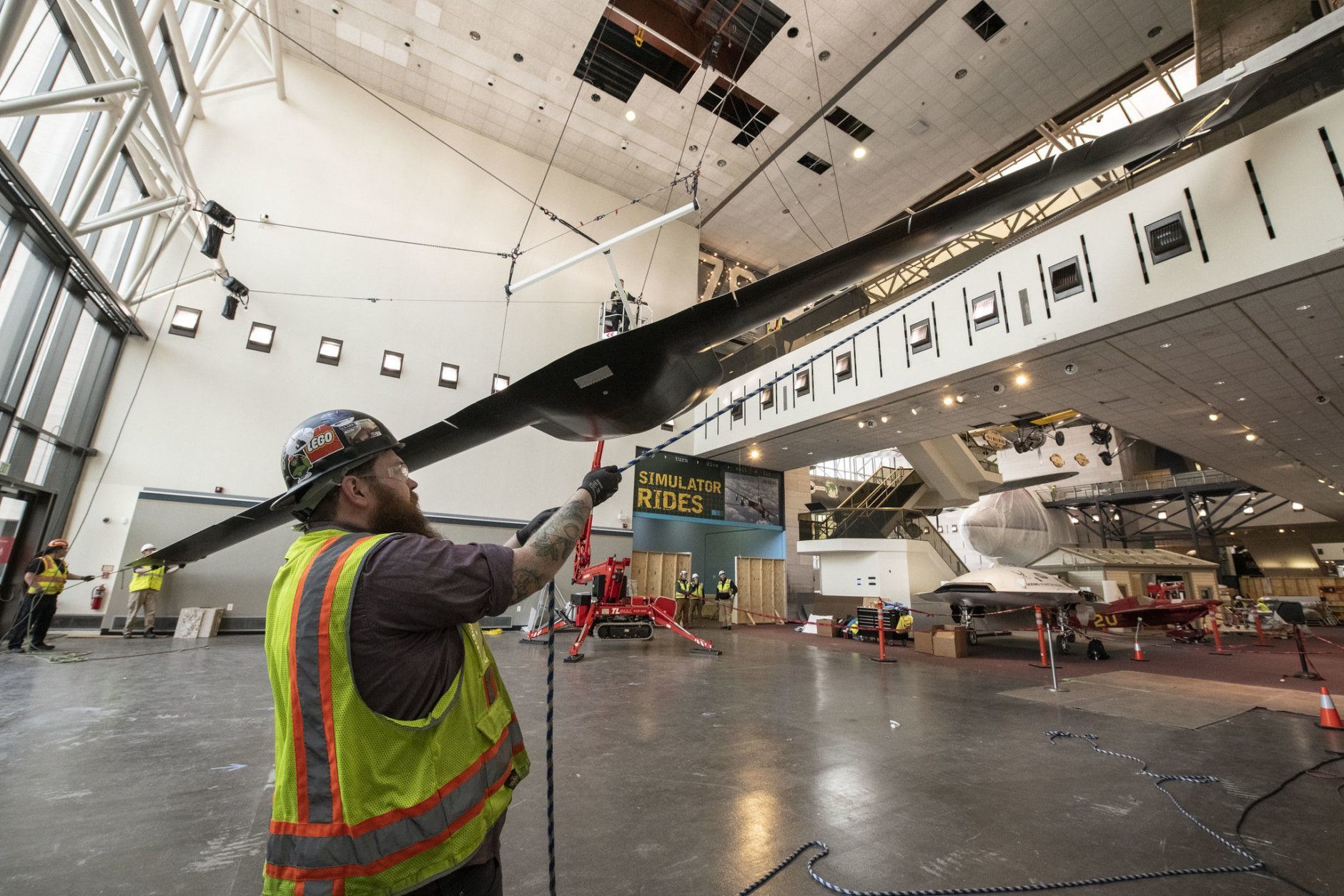 The Lockheed Martin/Boeing RQ-3A DarkStar aircraft is lowered in the Military Unmanned Aerial Vehicles exhibit during west end renovation of the National Air and Space Museum in Washington, DC, March 7, 2019. (Smithsonian photo by Jim Preston)  Material is subject to Smithsonian Terms of Use. Should you wish to use National Air and Space material in any medium, please submit an Application for Permission to Reproduce NASM Material, available at:  https://airandspace.si.edu/permissions