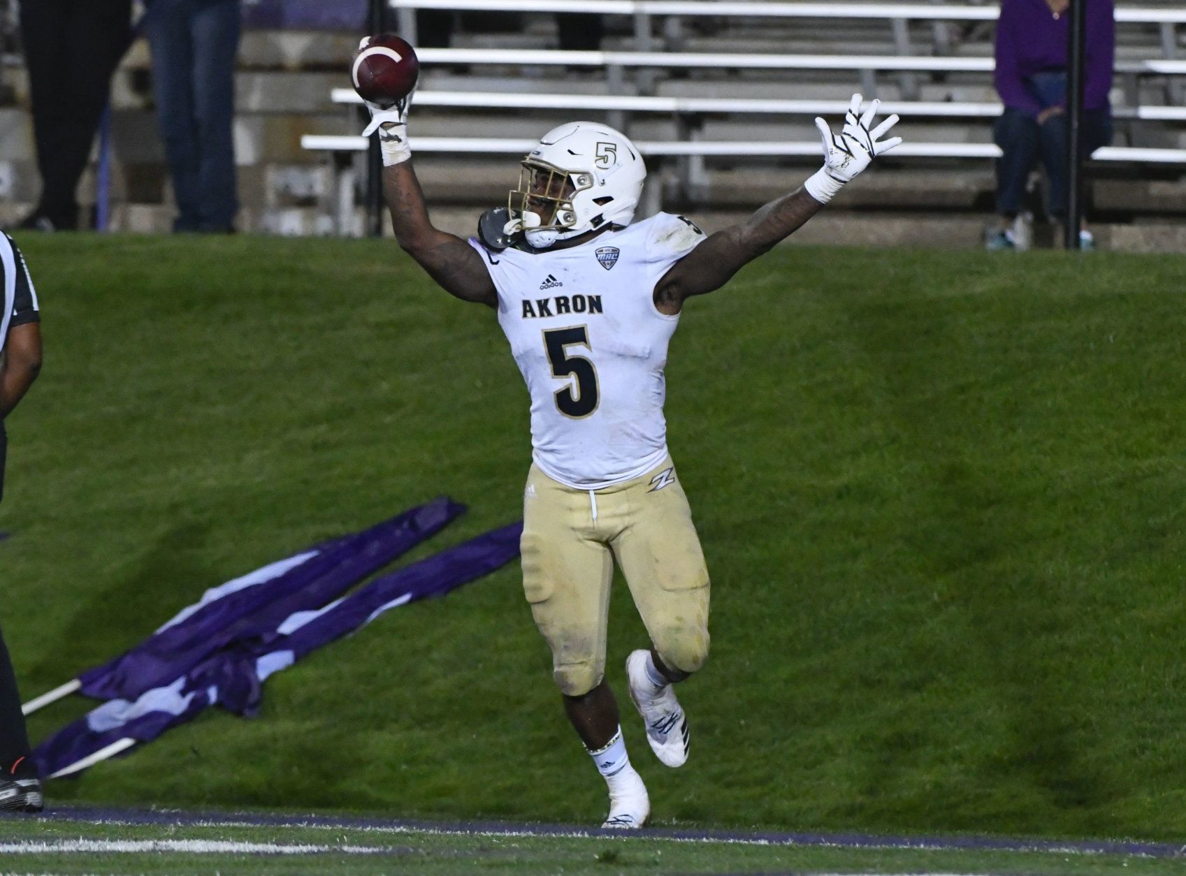 Akron linebacker Ulysees Gilbert III (5) celebrates after he picks up a loose ball for a touchdown against Northwestern during the second half of an NCAA college football game in Evanston, Ill., Saturday, Sept. 15, 2018. (AP Photo/Matt Marton)