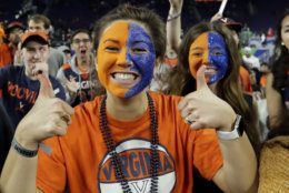 Virginia fans cheer before a semifinal round game against Auburn at the Final Four NCAA college basketball tournament, Saturday, April 6, 2019, in Minneapolis. (AP Photo/David J. Phillip)