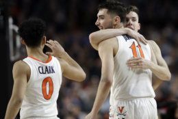 Virginia's Kihei Clark (0), Ty Jerome (11) and Kyle Guy react during the second half in the semifinals of the Final Four NCAA college basketball tournament against Auburn, Saturday, April 6, 2019, in Minneapolis. (AP Photo/David J. Phillip)