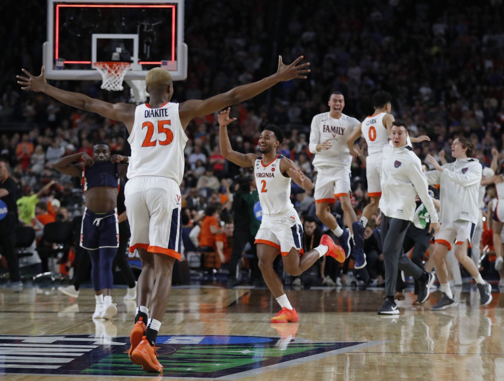 Virginia players celebrate after defeating Auburn 63-62 in the semifinals of the Final Four NCAA college basketball tournament, Saturday, April 6, 2019, in Minneapolis. (AP Photo/Charlie Neibergall)