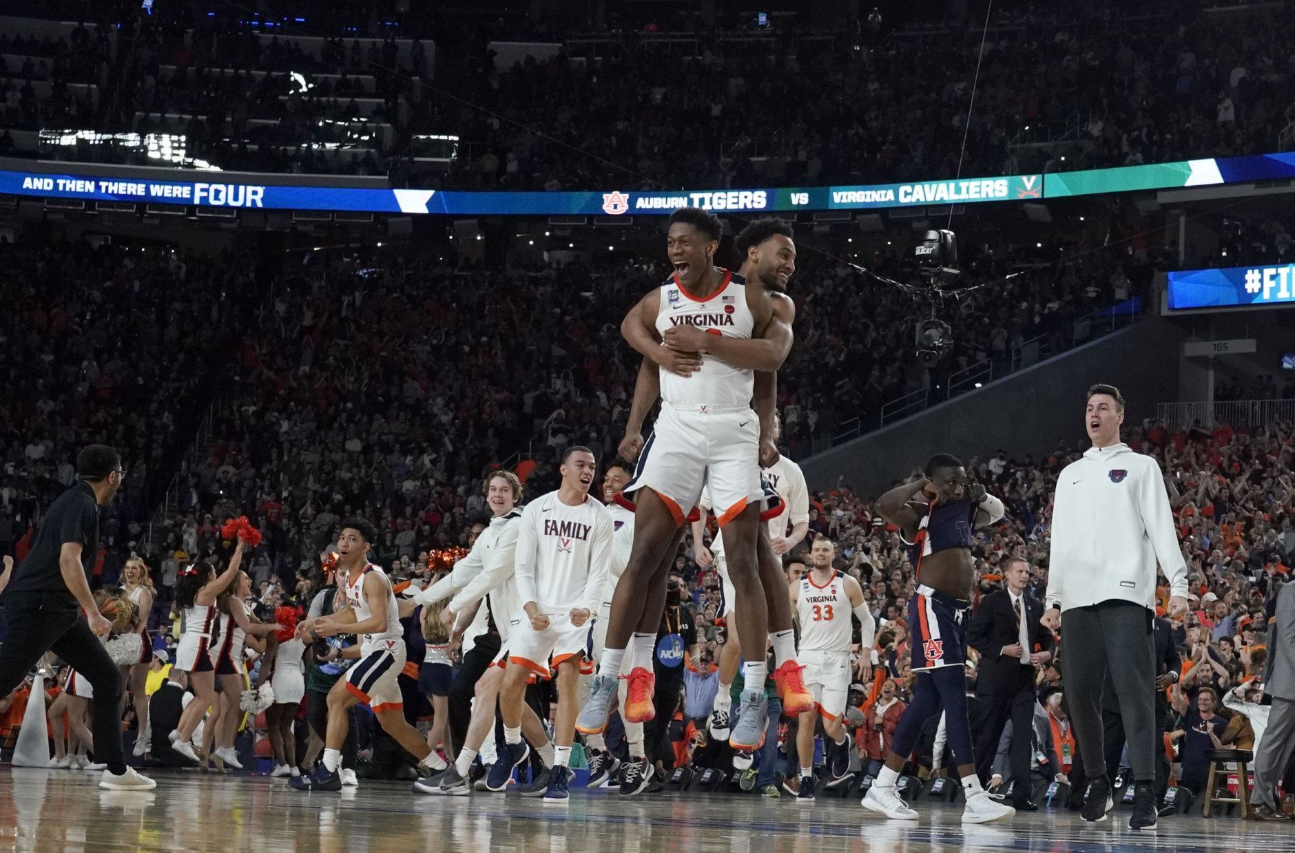 Virginia players celebrate after defeating Auburn 63-62 in the semifinals of the Final Four NCAA college basketball tournament, Saturday, April 6, 2019, in Minneapolis. (AP Photo/David J. Phillip)
