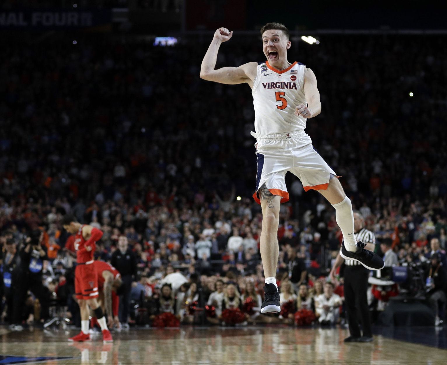 Virginia's Kyle Guy (5) celebrates after defeating Texas Tech 85-77 in the overtime in the championship of the Final Four NCAA college basketball tournament, Monday, April 8, 2019, in Minneapolis. (AP Photo/David J. Phillip)
